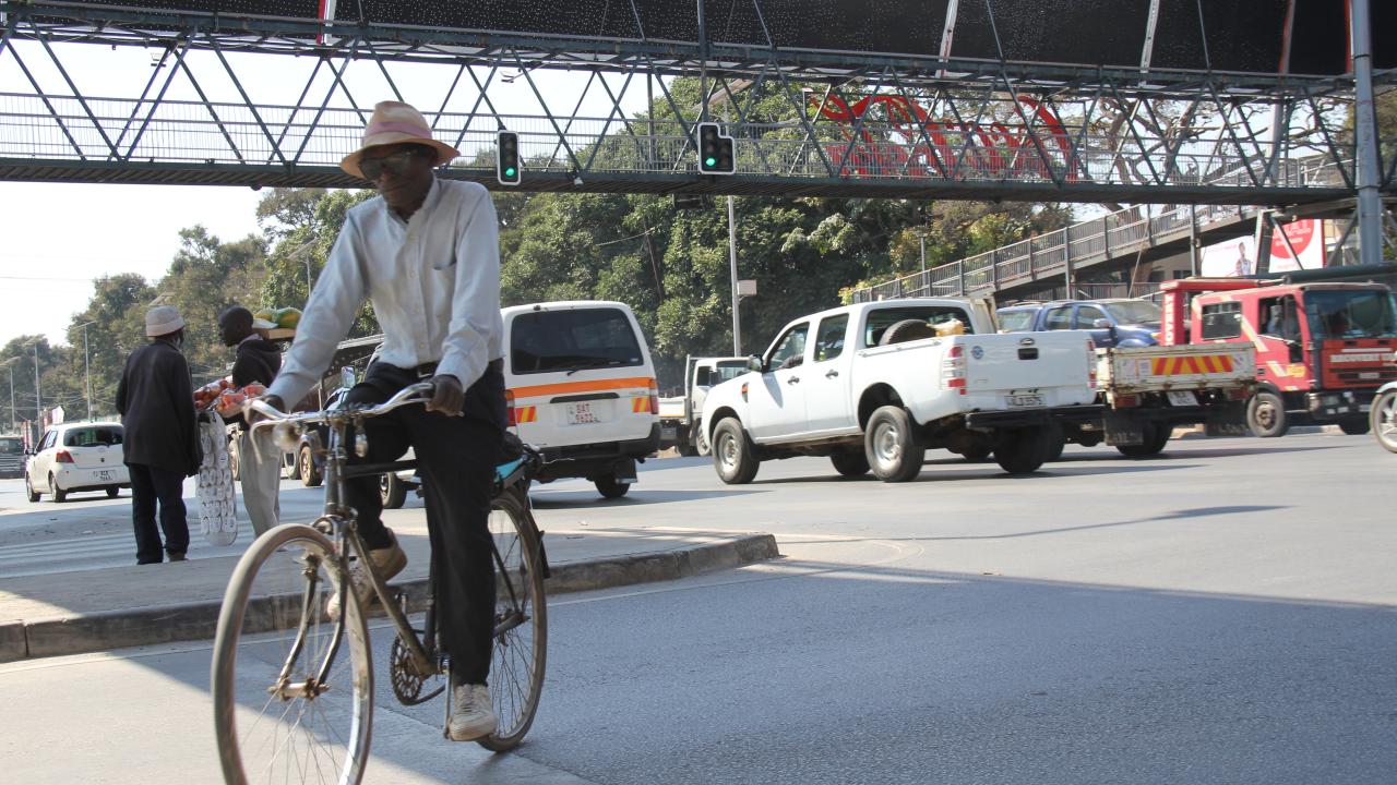 Man on a bicycle in Lusaka, Zambia.